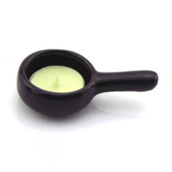 Black ceramic tea light candle holder with an unlit candle by Garden of Alice