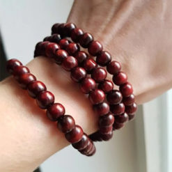 Red Tibetan Mala Beads 108 Pieces Worn on Wrist by Garden of Alice Customer